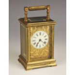 A late 19th century French brass cased carriage timepiece, the case with beaded detail and angular