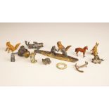 A selection of thirteen miniature metal figures, 20th century, including a painted model of two cats