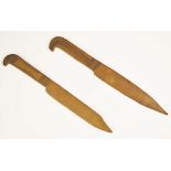 Two Trench Art knives, each brass knife designed as a bayonet, with engraved details to the hilts,
