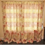 * A pair of lined curtains, tulip and iris pattern in red, gold and green colourways upon an ivory