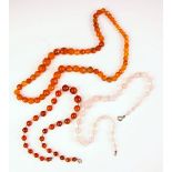 A strand of untested carnelian beads, the necklace designed as sixty-four naively strung graduated