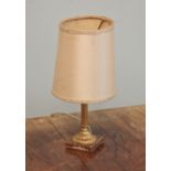 * A gilt metal column table lamp, the fluted column extending to a leaf moulded base upon a square
