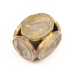 A 20th century gilt metal six sided seal, the cube shaped seal with intaglio matrixes depicting