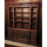 * A 17th style carved oak Flemish bookcase, 19th century, the cornice carved with scrolling