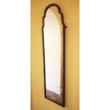 * A Queen Anne style wall mirror, early 20th century, of arched form, within a moulded mahogany