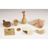 A selection of antiquities, including a slab of stucco with applied label 'stucco taken from the