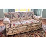 * A late 19th century three seater sofa, in the manner of Howard & Sons, the undulating back rest