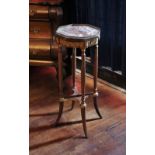 * A Louis XVI style walnut jardinere stand, late 19th century, the octagonal rouge marble top with a