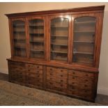 * A large Victorian mahogany library bookcase of country house proportions, the moulded cornice over