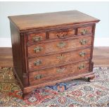 * A George III mahogany chest of drawers, the moulded top over an arrangement of three small and