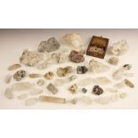 A collection of quartz crystals, predominantly colourless quartz examples of various sizes, also