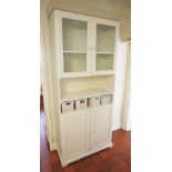 * A contemporary painted kitchen cabinet, formed as a pair of glazed doors over a shelved recess and