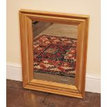 * A giltwood framed wall mirror, the moulded frame enclosing the later mirrored plate, 71cm H x 54cm