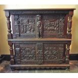 * A 17th century style Flemish oak court cupboard, 19th century, the rectangular moulded top upon