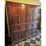 * A large freestanding oak spice cupboard, 18th century, the twin quatre panelled doors opening to