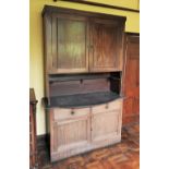 * A Regency mahogany work/wash cabinet, later converted, the pair of panelled cupboard doors over