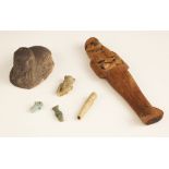 An Egyptian wooden ushabti figure, the carved shabti figure of typical form 17.7cm long, with a