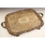 A large silver plated rectangular tray, the cast scrolling ivy leaf detailed rim with twin