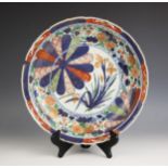 A Chinese porcelain imari charger, Kangxi (1661-1722) the circular charger with ogee rim enclosing a