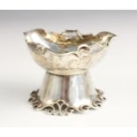 An Arts and Crafts, Victorian silver open salt, James Dudley, London 1894, the shaped rim with three