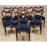 A set of eight early Victorian rosewood dining chairs, circa 1860, each with a compressed balloon