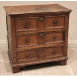 A Jacobean oak chest of drawers, the plank top above an arrangement of three elm lined long drawers,