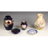 Six pieces of Moorcroft, 19th century and later, comprising: a vase in the Spring Blossom pattern,