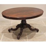 A Victorian rosewood loo table, the tilting oval top upon a tapering acanthus pedestal and