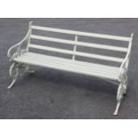 A Coalbrookdale type painted cast iron and slatted hardwood bench, the bench supports cast as