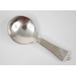 A Georg Jensen white metal caddy spoon, the plain polished caddy spoon in the pyramid pattern (