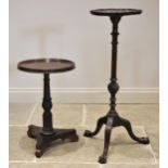 A Victorian rosewood wine/lamp table, the circular top with a moulded raised rim, upon a fluted,