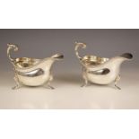 A pair of silver sauce boats, C.J Vander, London 1960, each of plain form with flying scroll and