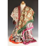 Four Liberty of London silk scarves, to include; a peacock and vase pattern narrow scarf in fuchsia,