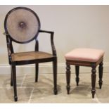 A mahogany bergere elbow chair, early 20th century, the circular cane work back rest centred with