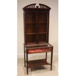 A mahogany Chinese Chippendale style, bijouterie display cabinet, early 20th century, the open