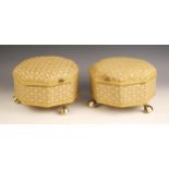 A pair of Victorian upholstered octagonal footstools, with hinged covers, upon three brass claw