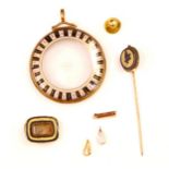 A selection of jewellery, to include a yellow metal and painted circular pendant/locket, the