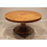 A Victorian pollard oak centre table, the segmentally veneered circular tilt top upon a tapering