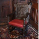 A 17th century oak Wainscot chair, the gadrooned top rail flanked by acorn finials above the back