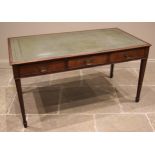 A mahogany library table, 20th century, the rectangular moulded top inset with a gilt tooled green