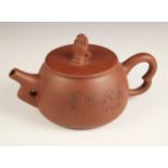 A Chinese Yixing teapot and cover, 20th century, the teapot of compressed circular form with