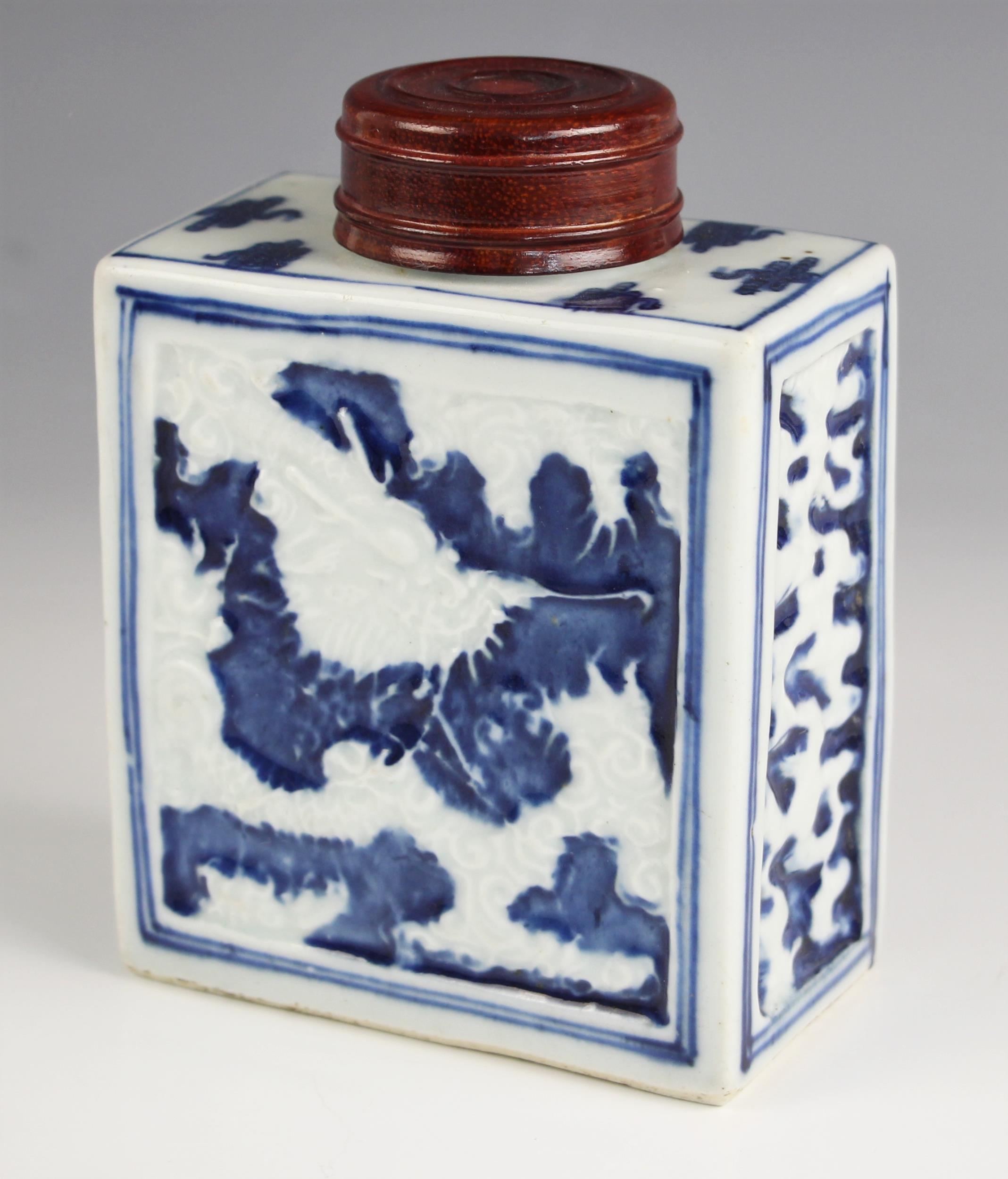 A Chinese porcelain blue and white tea caddy, 18th century, of rectangular form and relief decorated