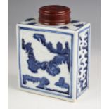 A Chinese porcelain blue and white tea caddy, 18th century, of rectangular form and relief decorated