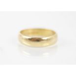 An 18ct yellow gold wedding band, stamped 'CG&S' Birmingham 1985, ring size O, 4.3gms