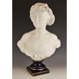 A Limoges bisque bust, 20th century, modelled as a young lady wearing a bonnet, signed Alex Duverger