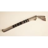 A Middle-Eastern white metal mounted dagger/kris, late 19th century, with shaped hilt and and