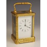 A brass cased repeater carriage clock, by Pierre Drocourt, late 19th century, the profusely chased