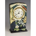 A Moorcroft Lamia pattern mantel clock, dated 2001, designed by Rachel Bishop, the white dial set