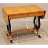 A Biedermeier style satin birch sofa table, 20th century, the rectangular top with rounded leaves