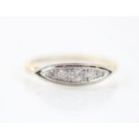 An early 20th century diamond ring, the five graduated mixed cut diamonds within white metal lozenge